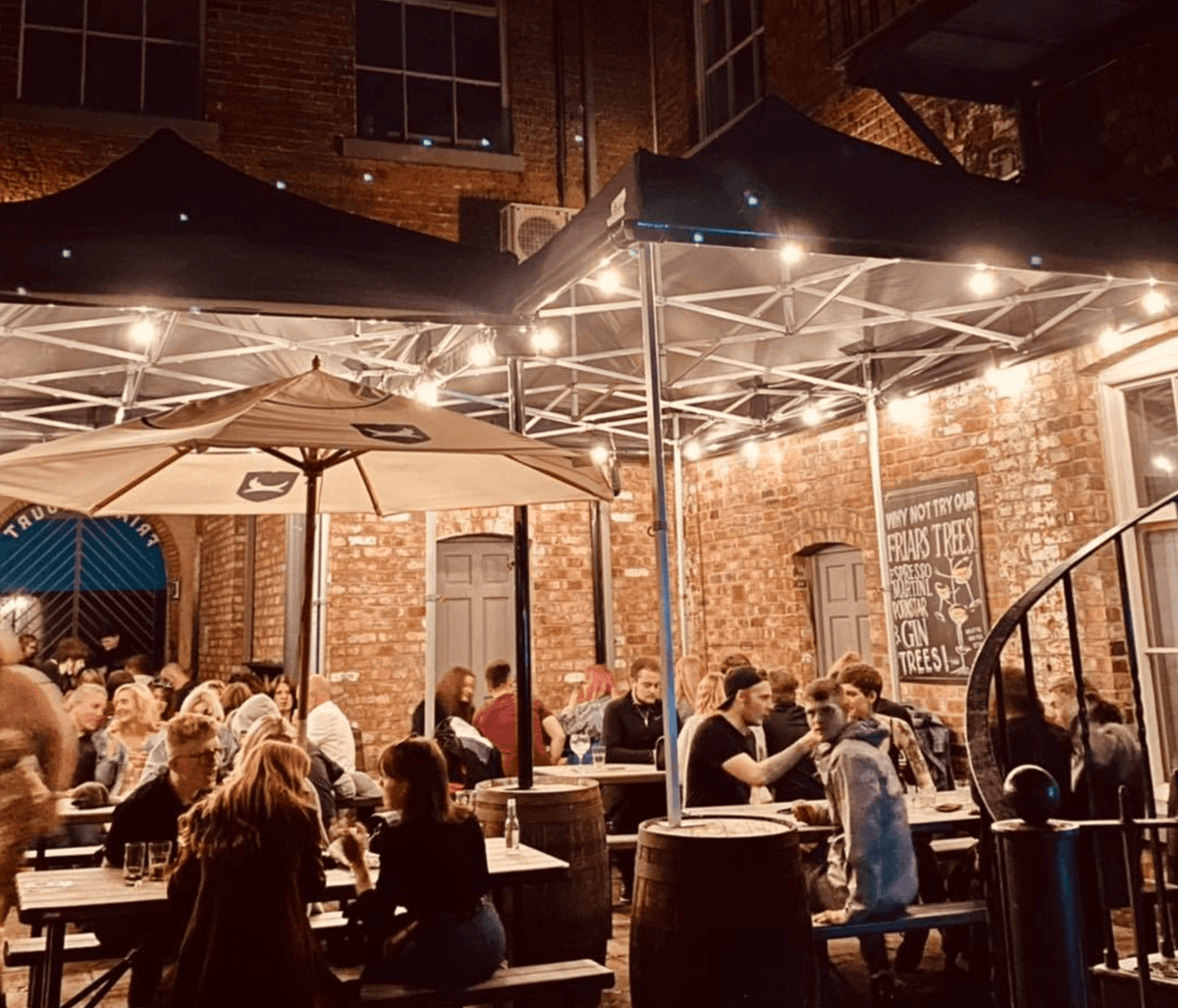 pop up gazebos covering bar outdoor area