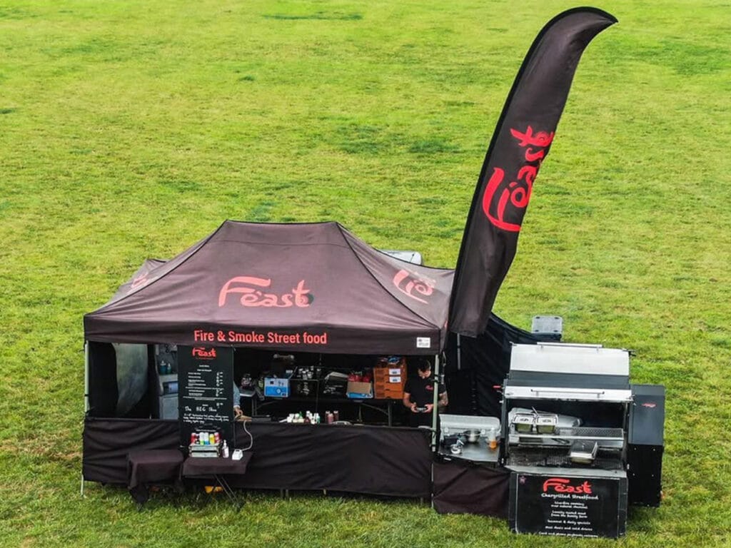 Custom printed pop up gazebo setup for a street food stall supplied by Surf & Turf Instant Shelters